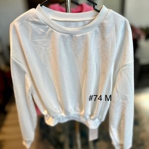 Cream colored top size m, new.